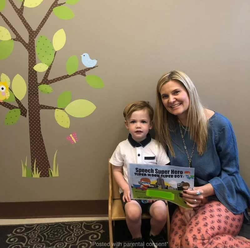 let's talk speech 2 Smiling speech-language pathologist working with toddler during early intervention session in Mission Viejo.